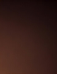 Deep brown professional headshot backdrop, smooth digital texture, warm gradient, subtle vignette lighting 1