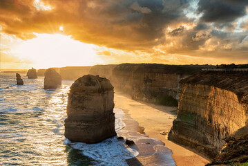 The shoreline with of the 12 Apostles in Victoria, Australia at a golden hour sunset