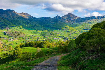 Summit of Puy Mary in the Cantal mountains from a hiking trail through the forest of Mandailles-Saint-Julien