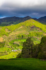 Obraz premium Panorama of the Cantal mountains around the Jordanne Valley from a hiking trail through the forest of Mandailles-Saint-Julien