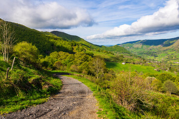 Fototapeta premium Panorama over the Jordanne Valley and the small village of Saint-Julien-de-Jordanne