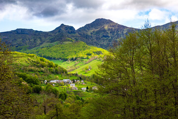 Summit of Puy Mary in the Cantal mountains from a hiking trail through the forest of Mandailles-Saint-Julien
