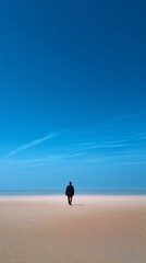 A Lone Figure Strolls a Tranquil Summer Beach Underneath Vast Blue Sky