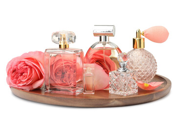 Many different perfume bottles and roses isolated on white