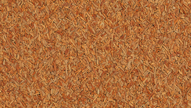 The ground is covered in small, brown wood chips, giving a natural touch to the outdoor area. Sunlight filters through surrounding trees, enhancing the rustic feel