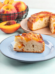 Piece of nectarine peach cake on turquoise table