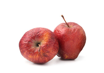Two whole rotten apples isolated on white