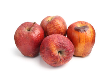 Many whole rotten apples isolated on white