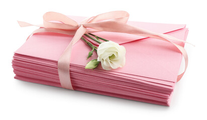 Stack of love letters and flower isolated on white