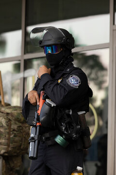 Los Angeles, California, USA - June 10, 2025: U.S. Customs and Border Protection (CBP) field officers guard a federal building during ICE deportation protests in Downtown LA. 