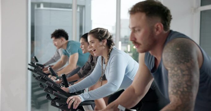 Happy people, coach or fitness with cycling in spin class for group exercise or workout at gym. Active, team or community on stationary bicycle with instructor for cardio training, health or wellness - Powered by Adobe