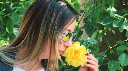 woman with yellow rose