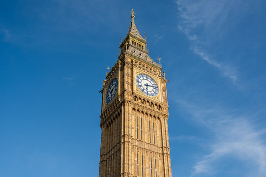 Big Ben in London against a blue sky.