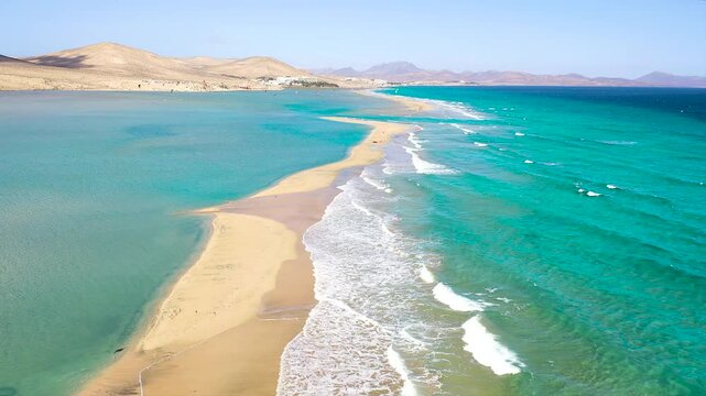 Aerial view of turquoise color of the sea, with high tide, in Sotavento Beach, Fuerteventura Island, Spain.