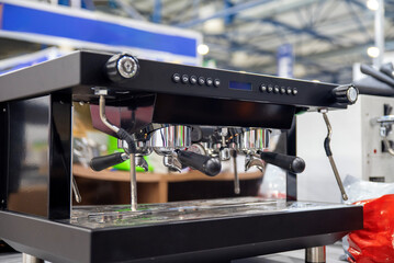 Dual-group espresso machine with chrome heads, gauges and steam wands