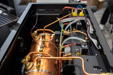 Copper boiler and wiring inside coffee machine