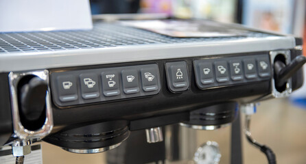 Control panel with programmable coffee buttons on commercial espresso machine