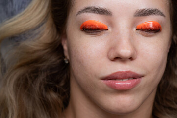 Caucasian woman undergoing eyelash lamination procedure. top view. 
