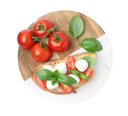 Tasty sandwich with mozzarella cheese, tomatoes and basil isolated on white, top view