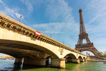 Eiffel Tower and Pont d'I&eacute;na bridge over Seine river in Paris, France