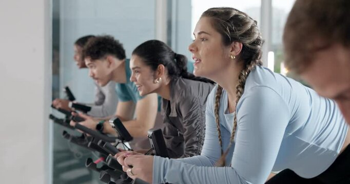 Happy people, coach or fitness with bicycle for spin class for group exercise or workout at gym. Active, team or community cycling with instructor or personal trainer for cardio, health or wellness