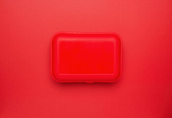 Plastic box on a red