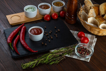 Caucasian sauce on a wooden background