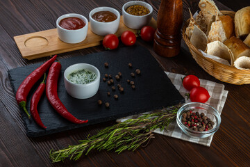 Sauce with sour cream and garlic on wooden background