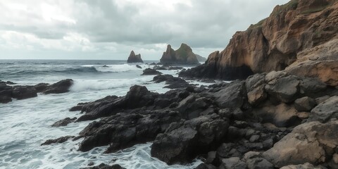 Obraz premium Rocky coastline with crashing waves and dramatic cliffs under a cloudy sky landscape photo