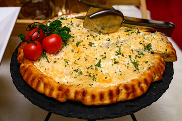 Pizza Margarita with mozzarella cheese, basil and tomato