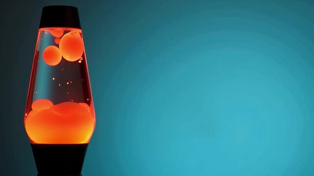 A lava lamp with floating orange bubbles glowing on a blue background