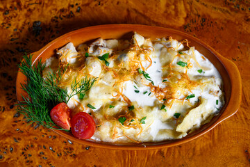 Mlinci is dish in Serbian and Croatian cuisine. It is a thin dried flatbread that is prepared by...