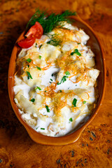 Mlinci is dish in Serbian and Croatian cuisine. It is a thin dried flatbread that is prepared by pouring boiled salted water or soup over the mlinci.
