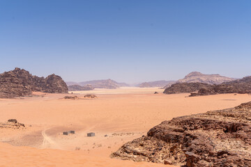 Fototapeta na wymiar Desert landscape with mountains and rocks under a dry sky