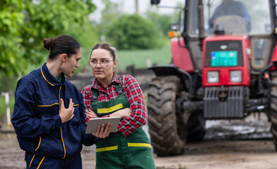 Female farm workers discussing next steps in plantation