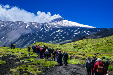 Hikers on Mount Etna Against a Dramatic Landscape © J