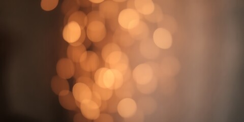 Fototapeta premium Abstract blurred background featuring warm golden bokeh lights creating a soft and dreamy effect