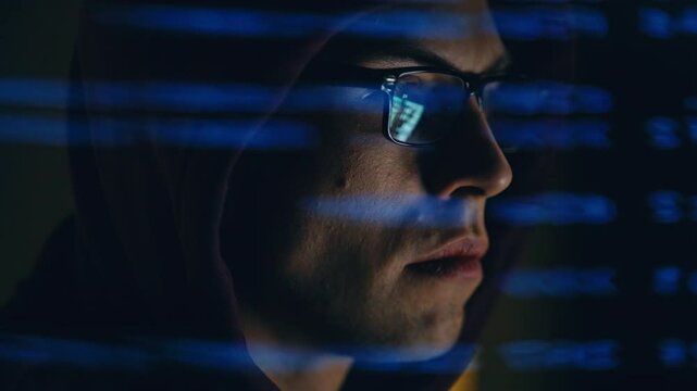 Technology specialist reviewing programming script digital display detailed view