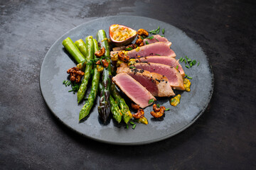 Tuna tataki steak with caramelized green asparagus, roasted cashew and  maracuja passion fruit...