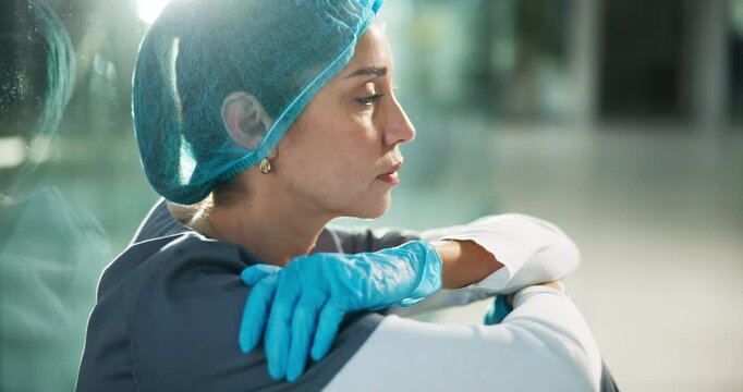 Medical, sad woman and doctor at night with thinking of patient loss with mistake, error or bad outcome. Fail, fatigue or upset with healthcare challenge, professional crisis or surgeon at hospital