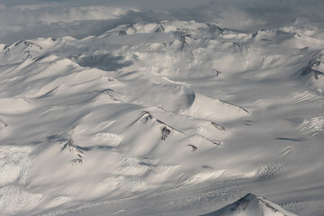 Fototapeta premium Aerial view of snowy mountains in Antarctica.