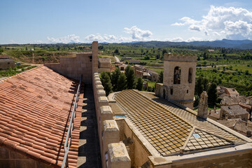 Historic Santa María la Mayor Church framed by medieval castle walls in Valderrobres, Teruel, with...