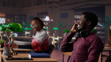 Noisy black guy disturbing pupils at the library by speaking very loud, being rude and answering...