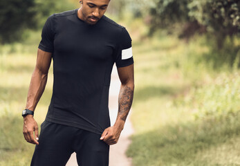 Fototapeta premium African-American Athlete In Blank T-Shirt Standing Outdoors, Empty Space For Your Text