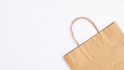 Brown Paper Shopping Bag on White Background - Minimalist Retail Mockup, Eco-Friendly Packaging, Blank Template for Branding and Design