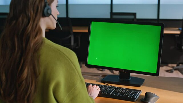 Call center green computer screen closeup. Woman service operator talking mockup