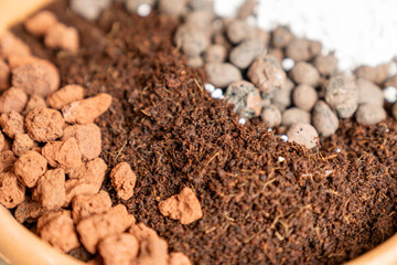 Organic potting soil mix with clay pebbles, coco coir, pumice and akadama for indoor plants,...