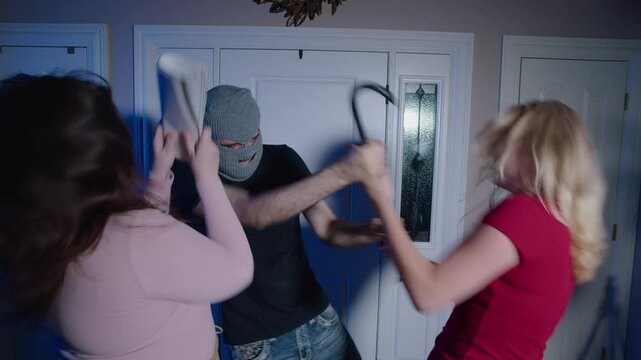 women fighting criminal