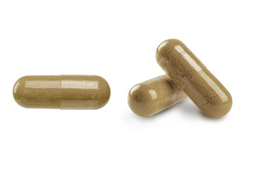Herbs capsule isolated on white background.