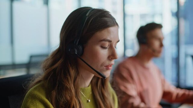 Thoughtful support agent listening customer solving request at workplace closeup
